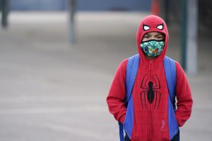 A student wears a mask while waiting for class to start amid the COVID-19 pandemic at Washington Elementary School on Jan. 12, 2022, in Lynwood. Photo by Marcio Jose Sanchez, AP Photo